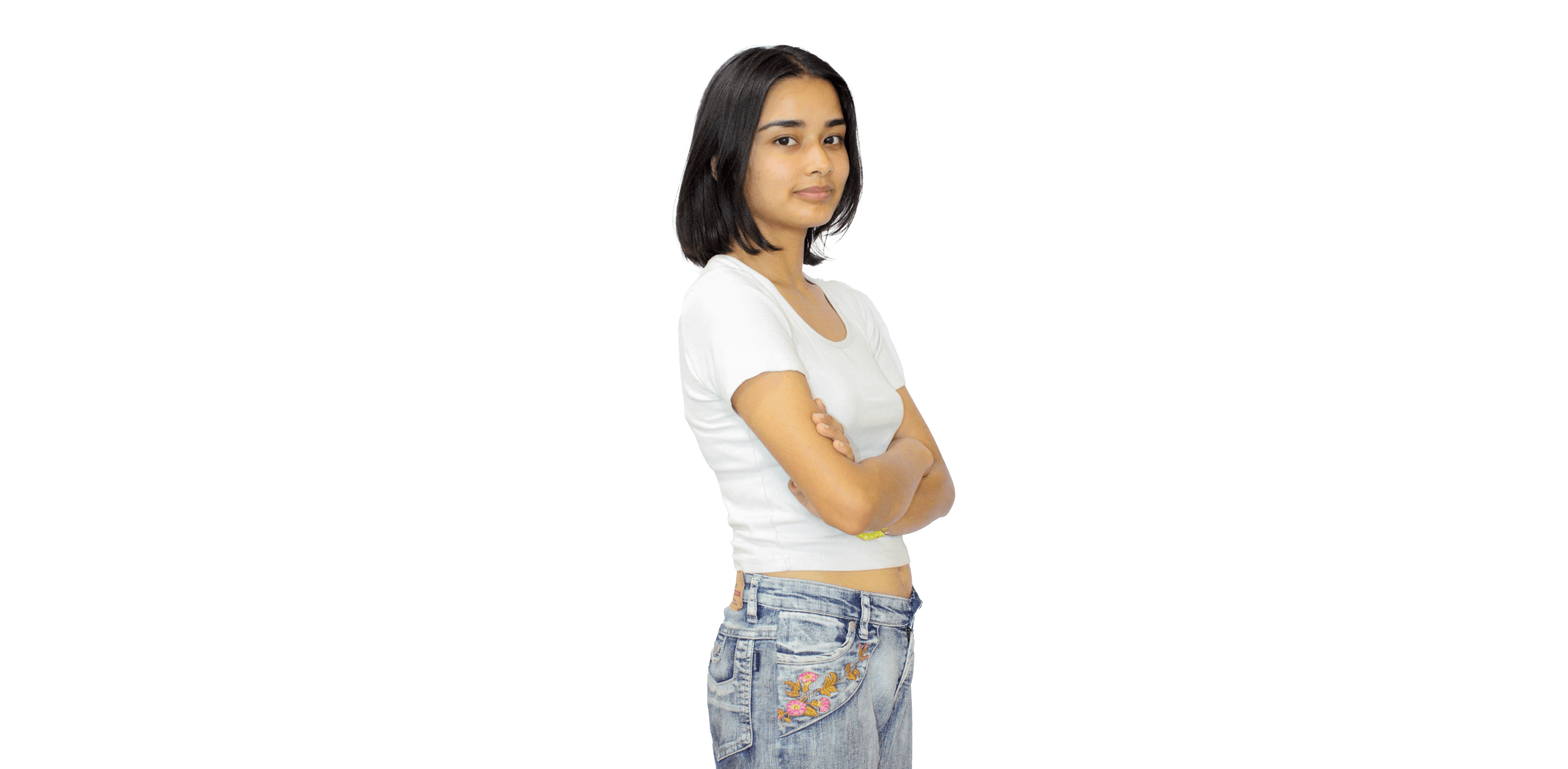 https://media.devpulse.info/A young woman with short, dark hair and light skin, wearing a white t-shirt and blue jeans, stands with her arms crossed, looking towards the viewer.